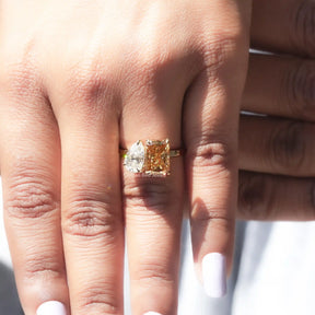 Moissanite Pear And Radiant Cut Ring in yellow gold 