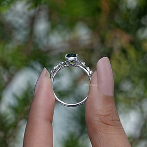 Back View of Peridot Green Oval Cut Gemstone Engagement Ring in two fingers