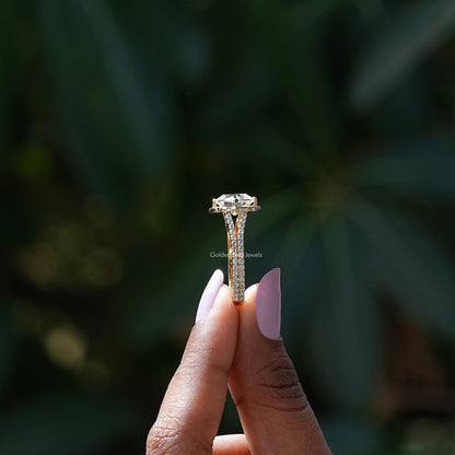 Side View of Round And Peruzzi Cut Moissanite Ring In two fingers