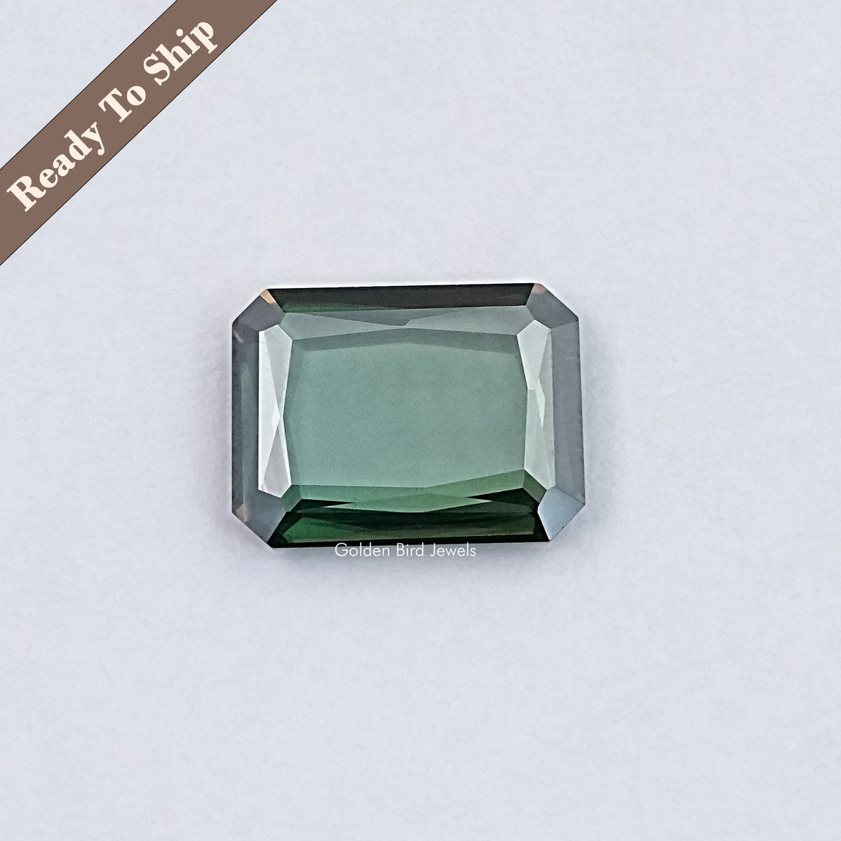 Emerald-cut green moissanite loose gemstone with faceted octagon shape