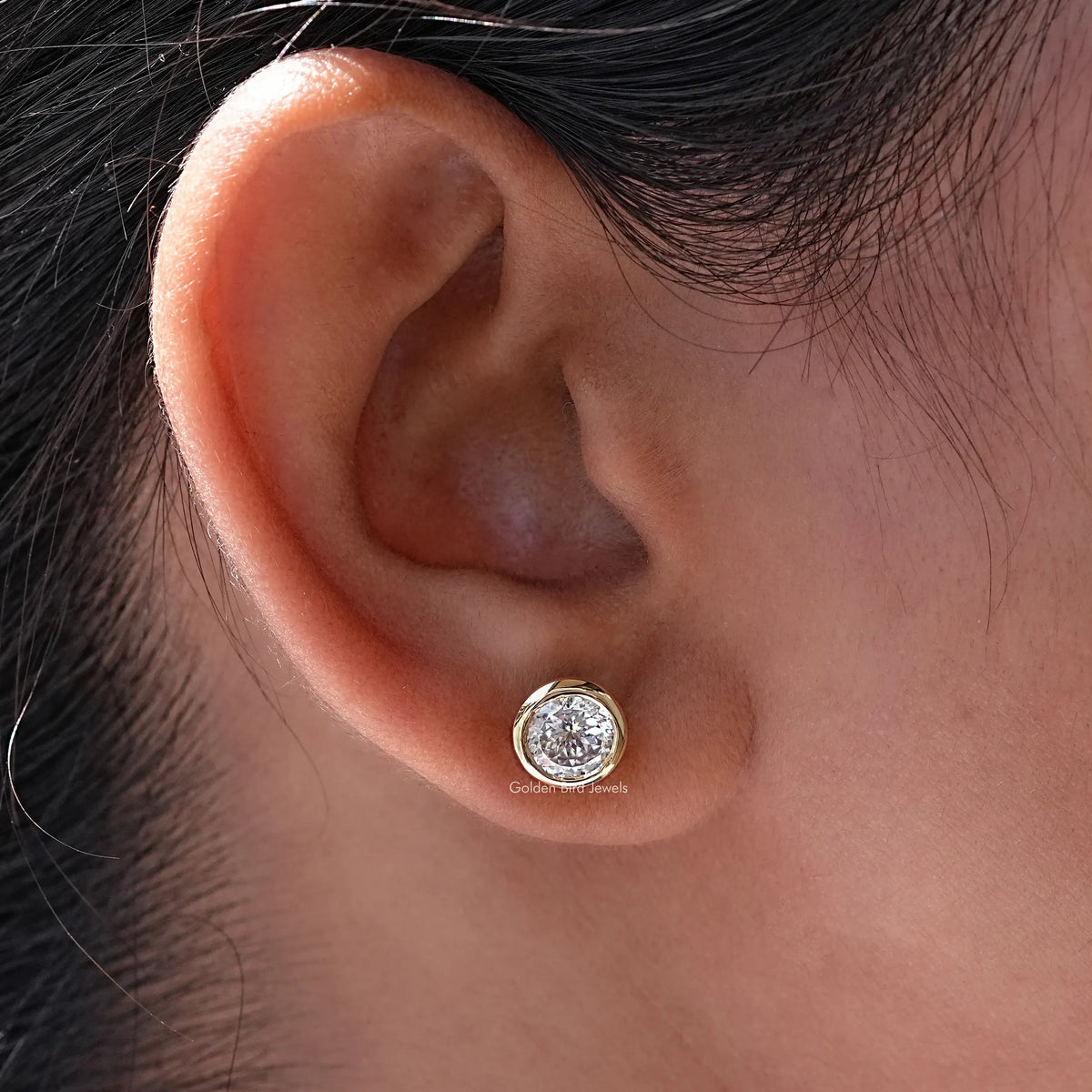 In Ear view of Portuguese Cut moissanite Stud Earrings 