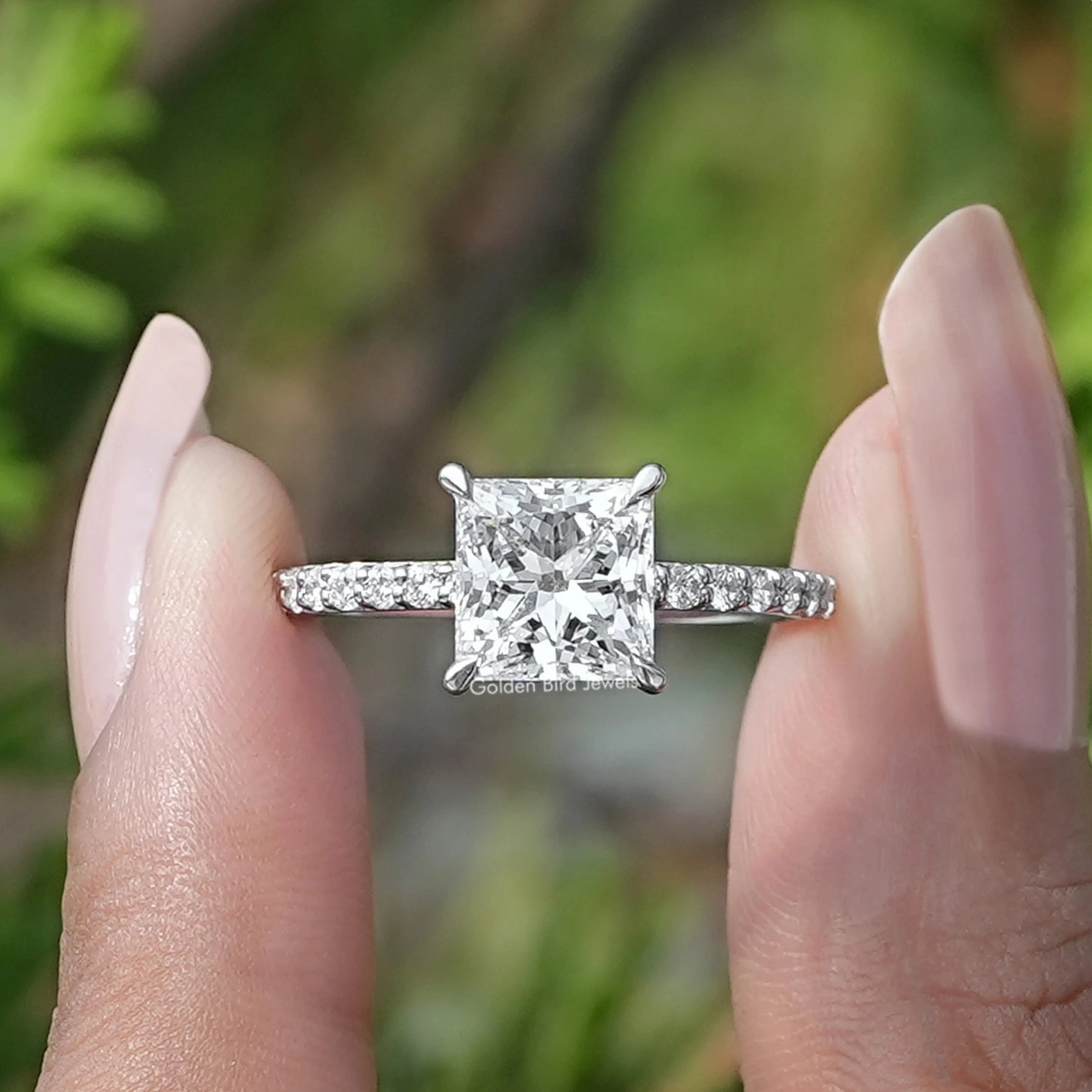 Front View of Princess Cut Lab Diamond Solitaire Ring In two fingers