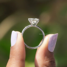 Back View of Princess Cut Moissanite Solitaire Ring In two fingers