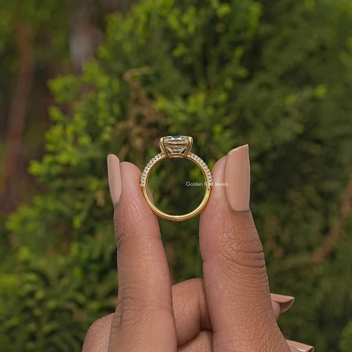 Rear view of gold-tone cushion-cut moissanite solitaire ring with open gallery