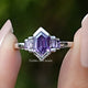Front view of Purple Amethyst Hexagon Gemstone Bezel Ring Set in two fingers 