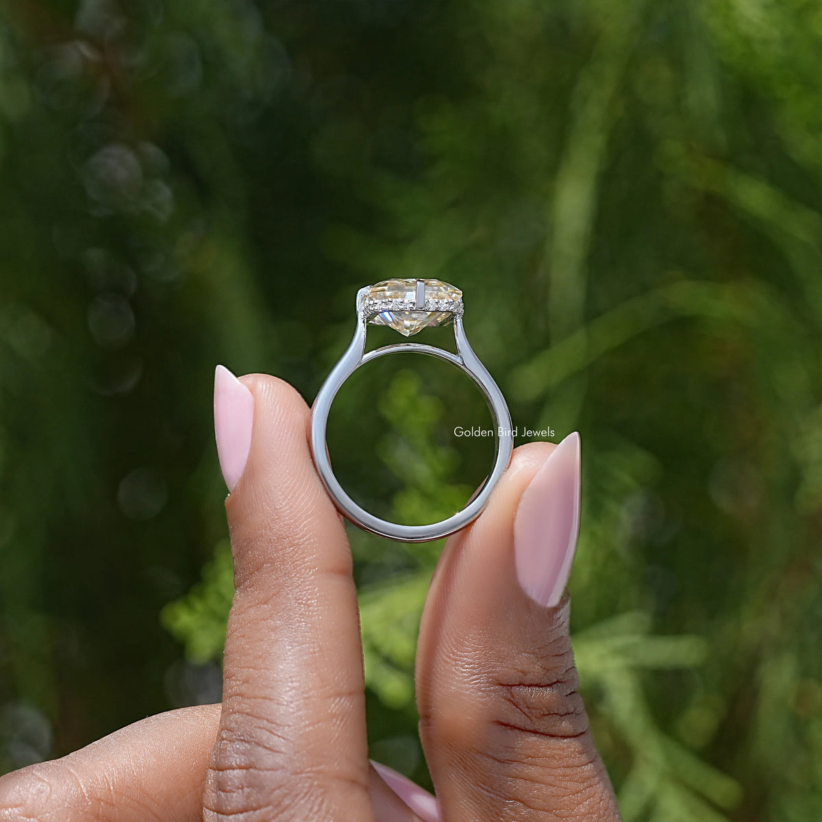 Yellow radiant-cut moissanite engagement ring from side view, silver band with prong-set top