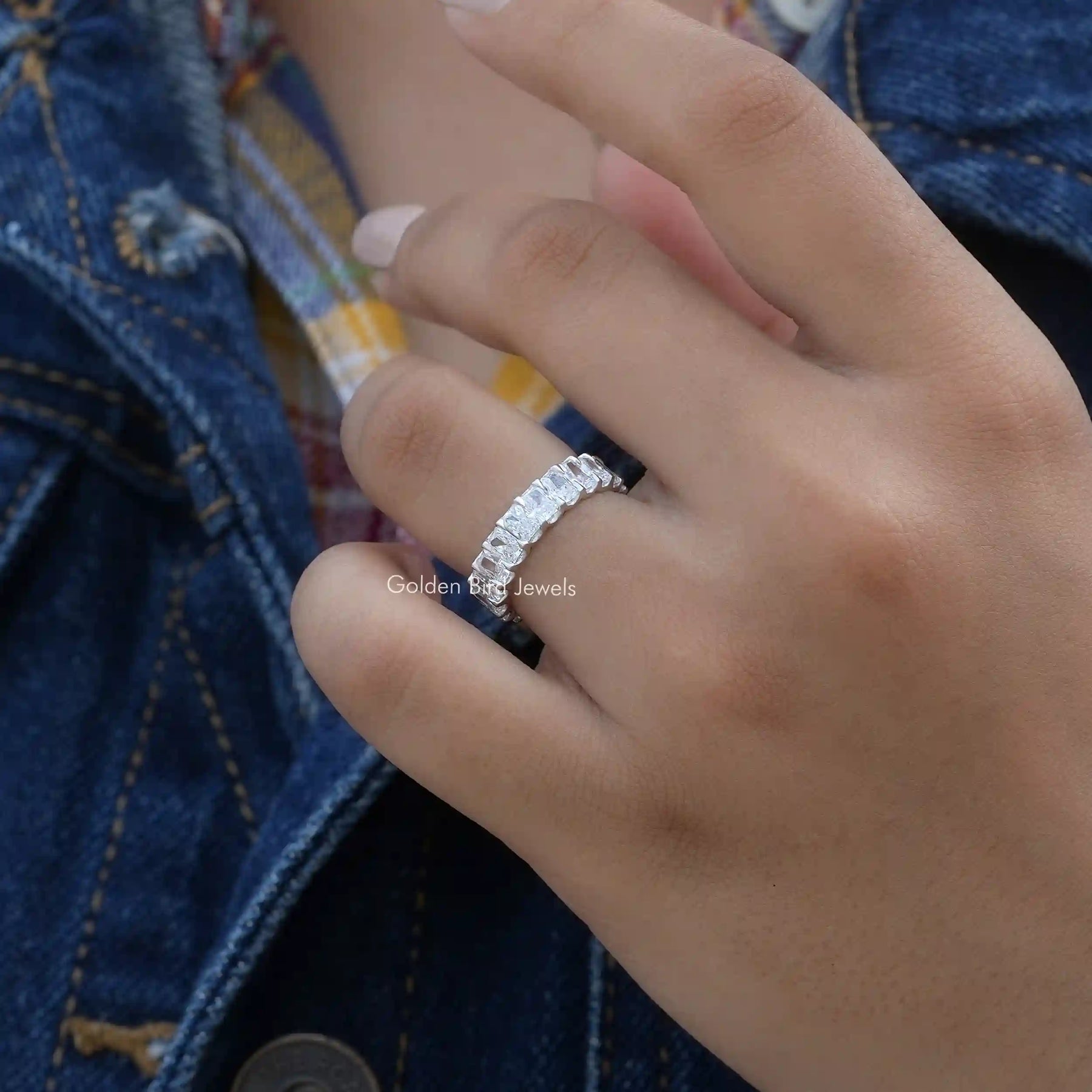 [Slightly folded finger front view of radiant cut lab-grown diamond ring]