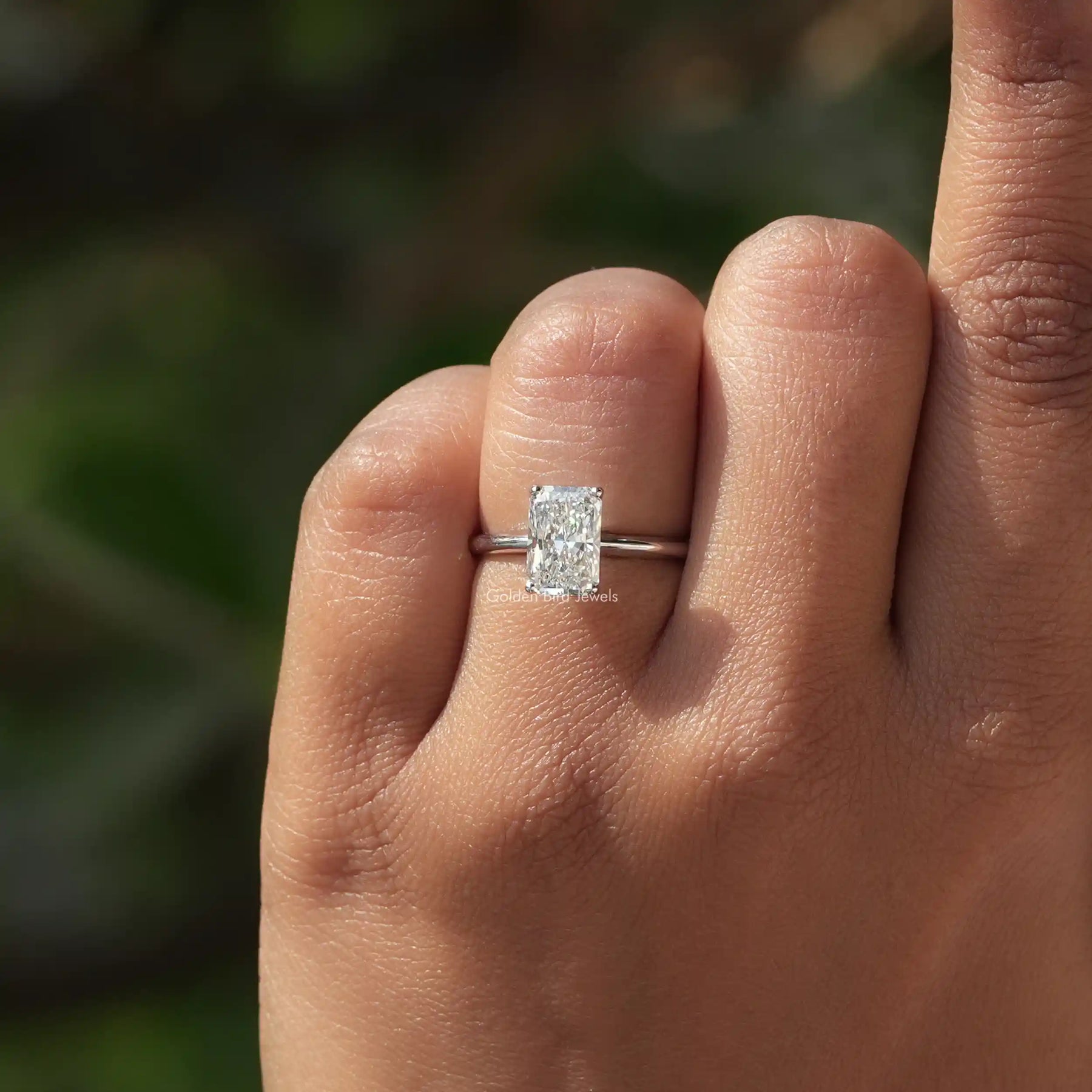 Close-Up View of Radiant Cut Diamond Engagement Ring In White Gold