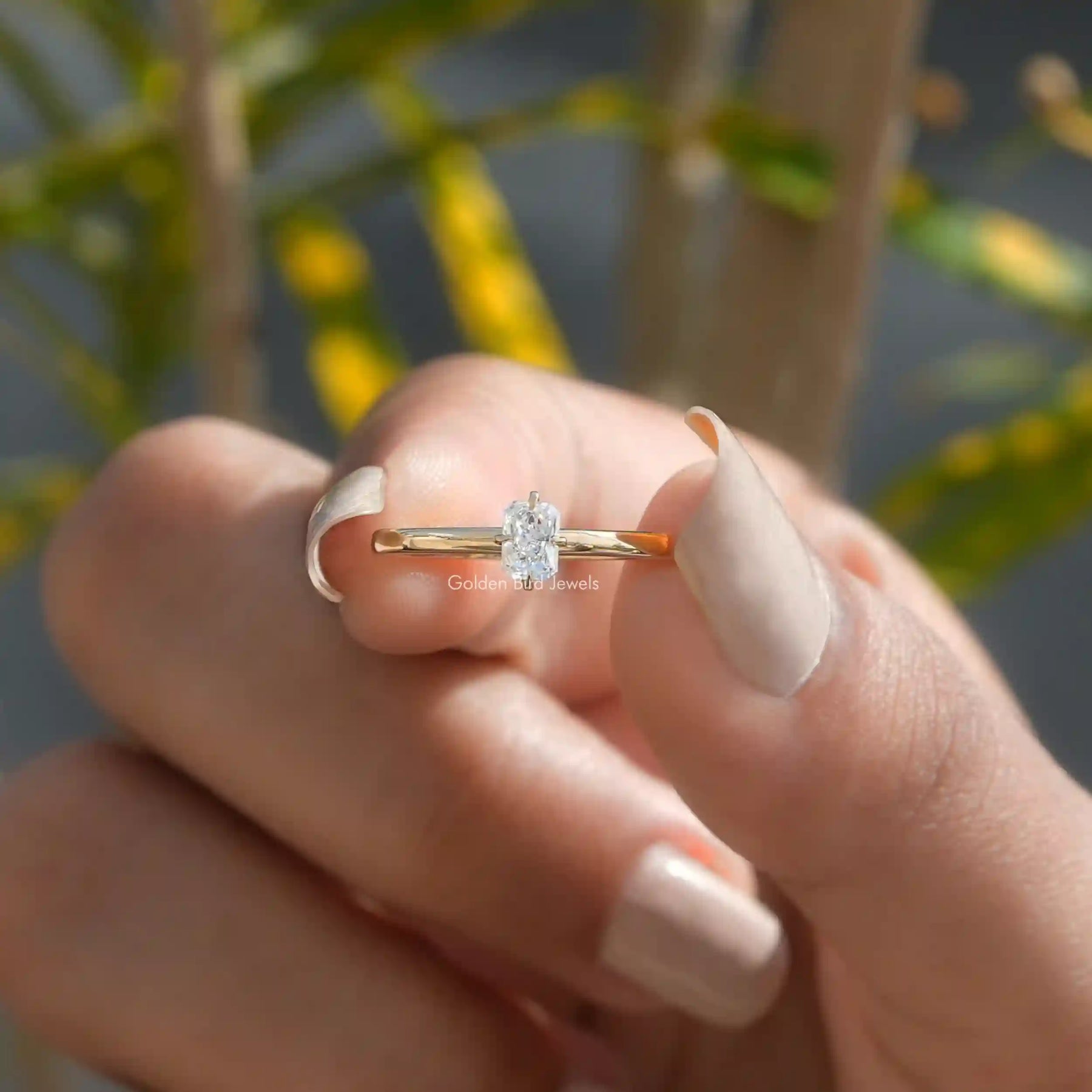 Front View of Radiant Cut Lab-Grown Engagement Ring In two Fingers