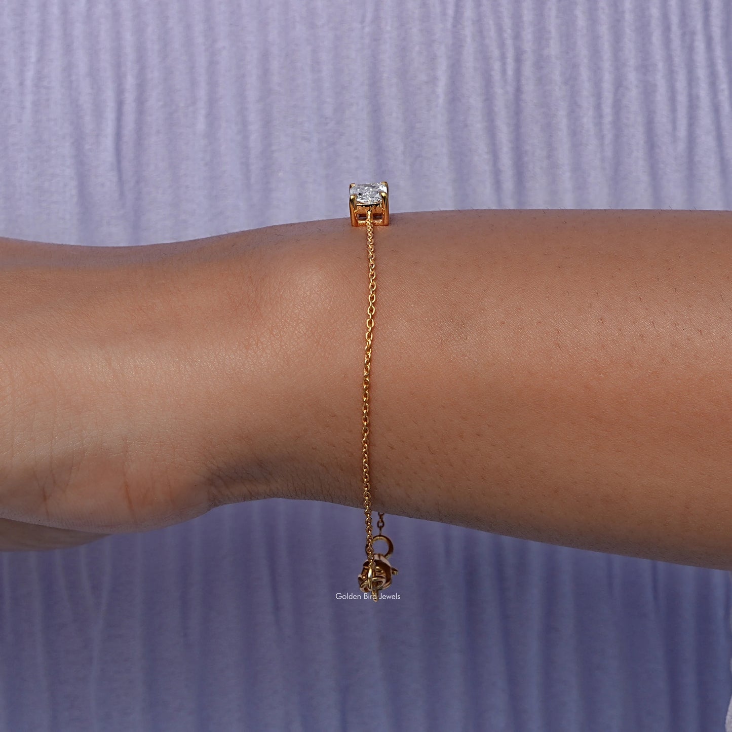 Side view of lab Radiant Cut Bracelet In yellow Gold