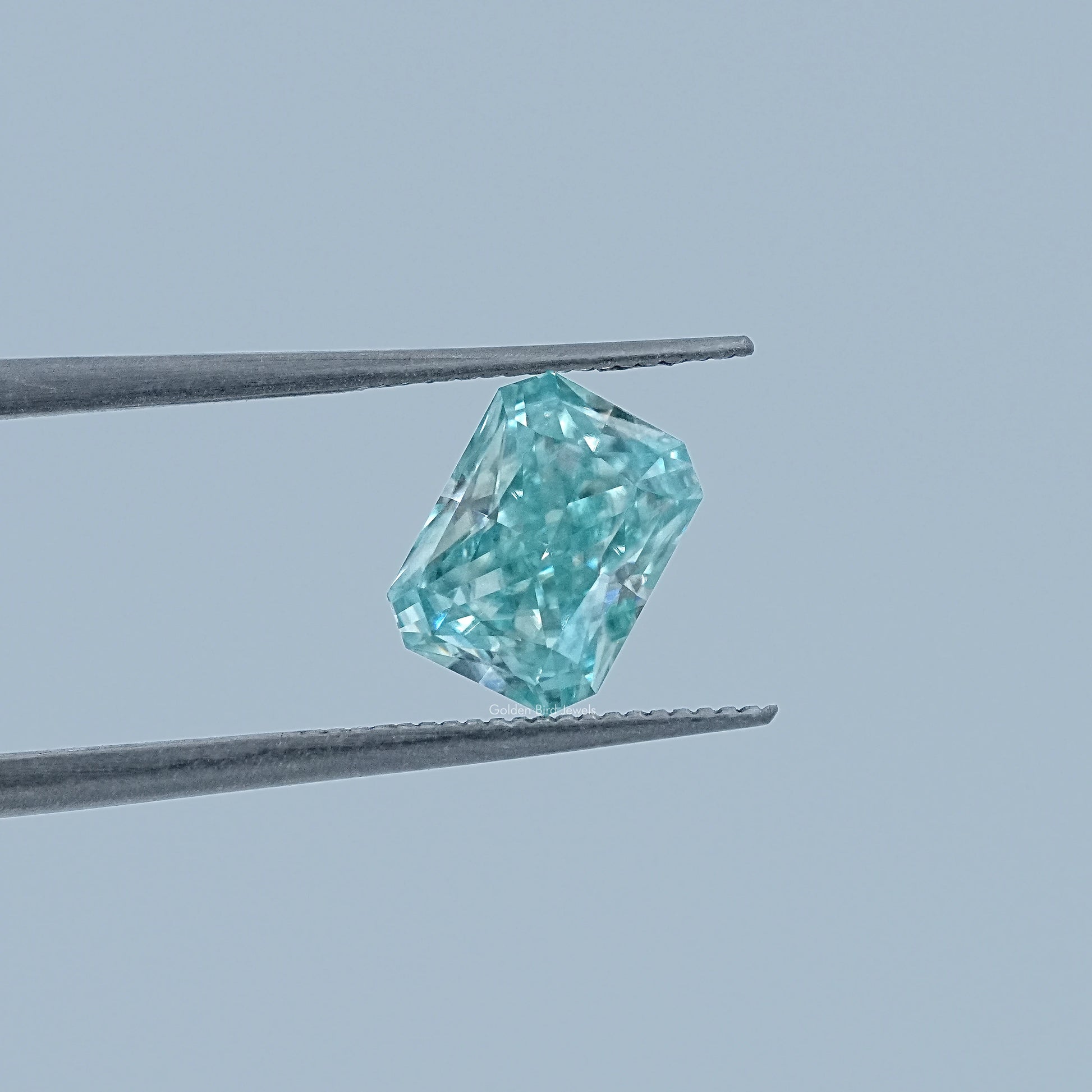 In Tweezer View Of Radiant Cut Loose Moissanite