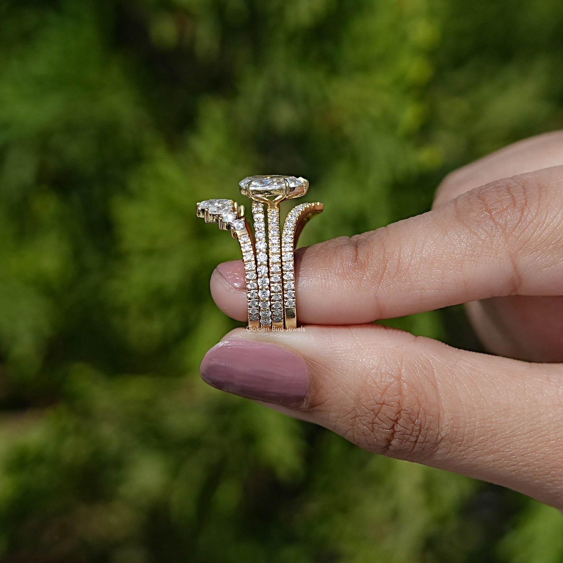 Side View of Rose Cut Pear Moissanite Wedding Ring In two fingers