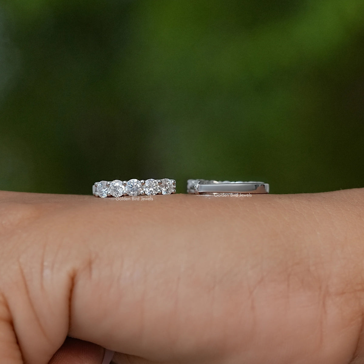 Moissanite round cut earrings with pavé-style stones, shown front and side views