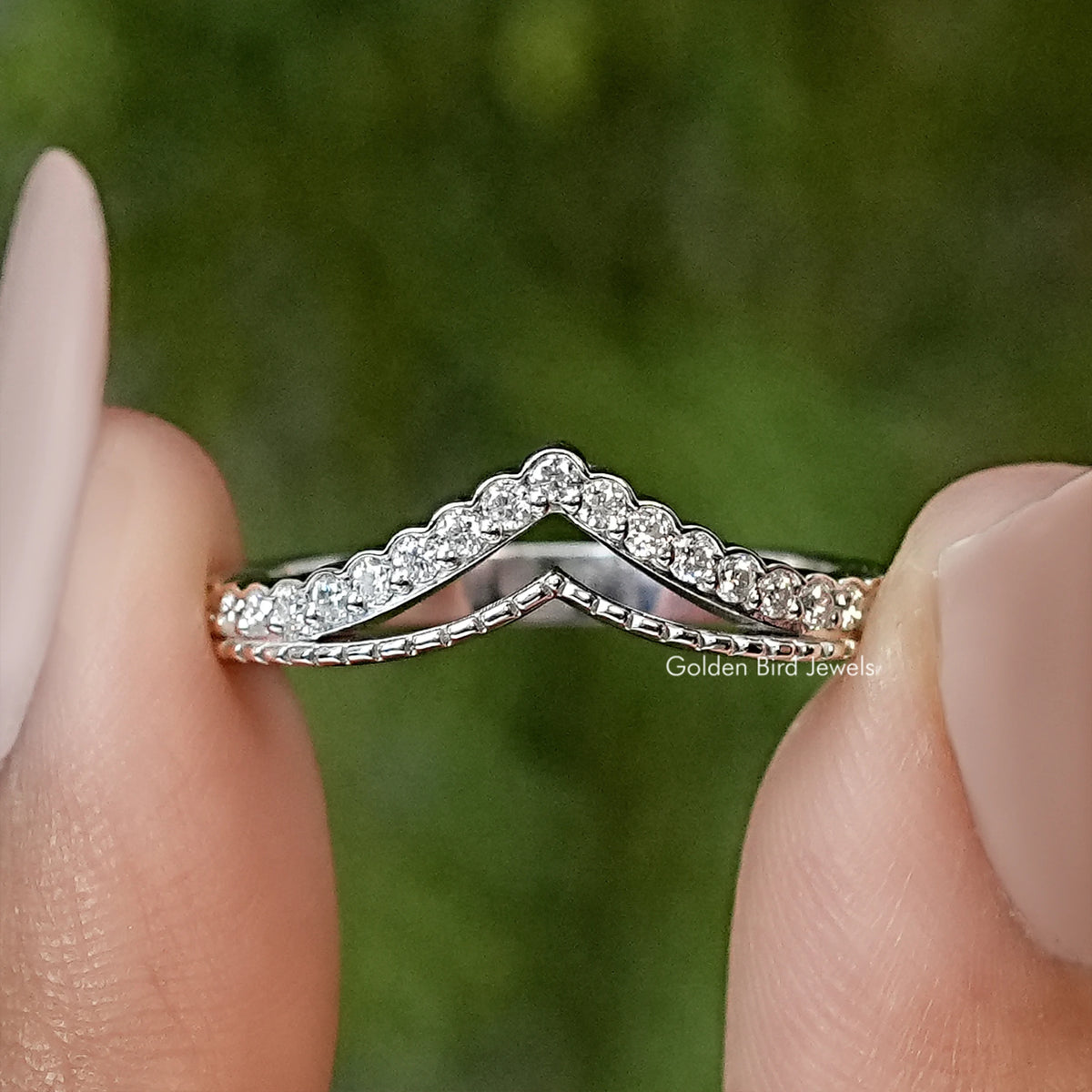 Silver V-shaped chevron wedding band with round moissanite sparkle stones