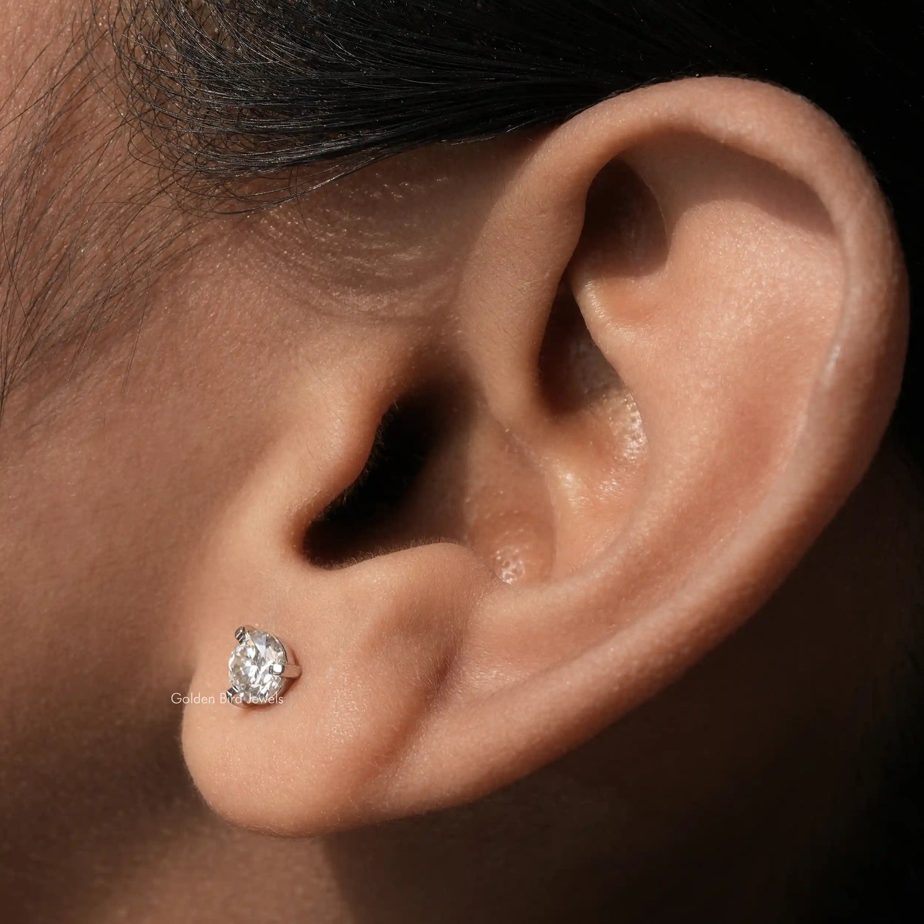 [In ear front view of round cut moissanite solitaire stud earrings]-[Golden Bird Jewels]