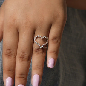 Detailed View Of Round Cut Moissanite Heart Shaped Ring In Yellow Gold
