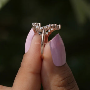 Side View of Round Cut Moissanite Heart Shaped Ring Set In two fingers