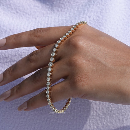 In hand showing view of moissanite round cut bracelet 