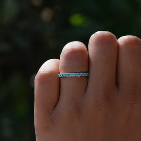 View of Blue Topaz Round Eternity Band in prongs setting