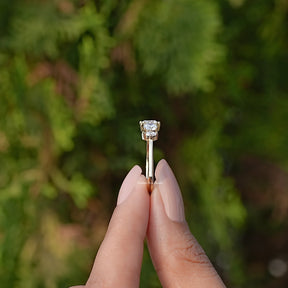 Side View of Round Cut Lab Diamond Five Stone Ring In two fingers