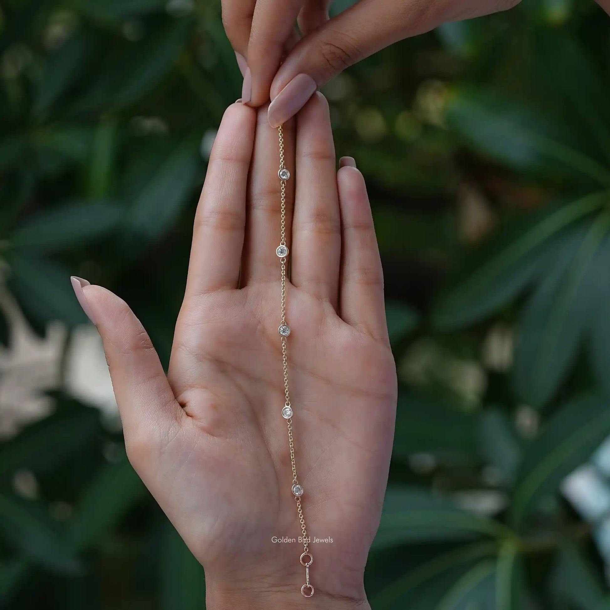 In hand showing view of moissanite bracelet