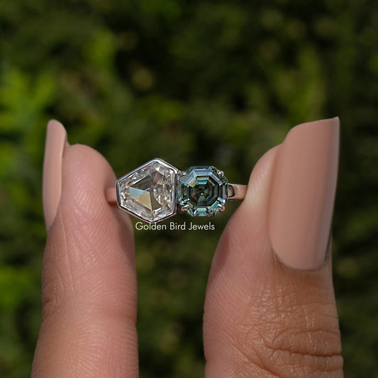 Sterling silver two-stone ring with clear and teal green shield-cut bezel stones