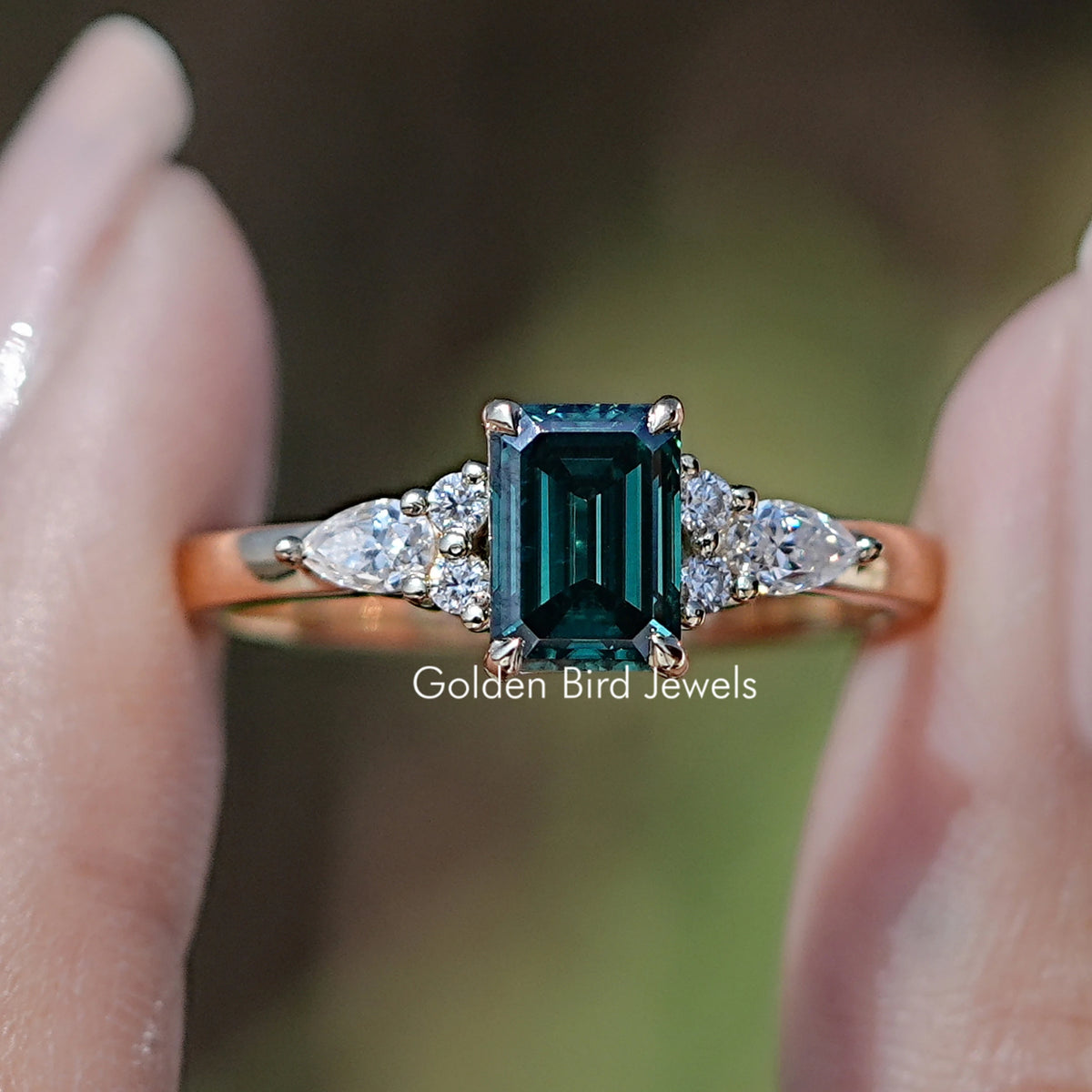 Front view of  Green Emerald cut engagement ring  