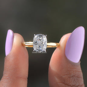 Two fingers holding the Cushion Cut Solitaire Diamond Ring