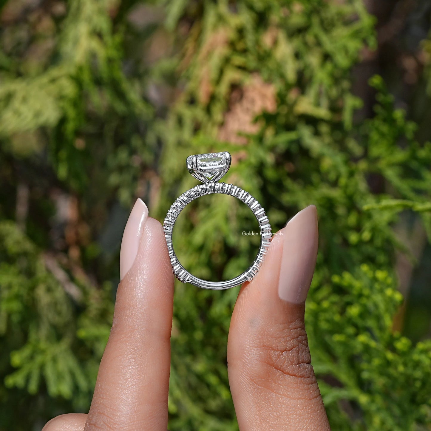 Back View of A Radiant Cut Lab Diamond Bridal Ring in two fingers
