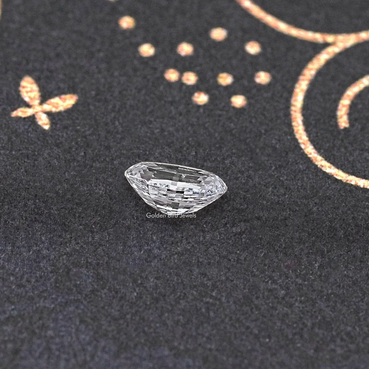 Loose lab-grown oval diamond, step-cut facets with a narrow profile