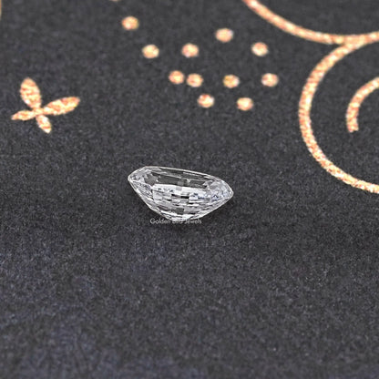 Loose lab-grown oval diamond, step-cut facets with a narrow profile