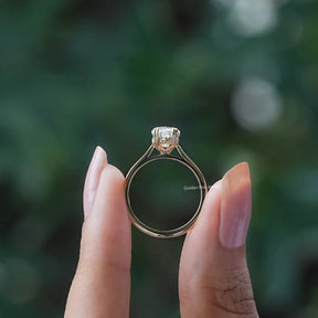 Back view A step cut dutch marquise diamond ring in two fingers