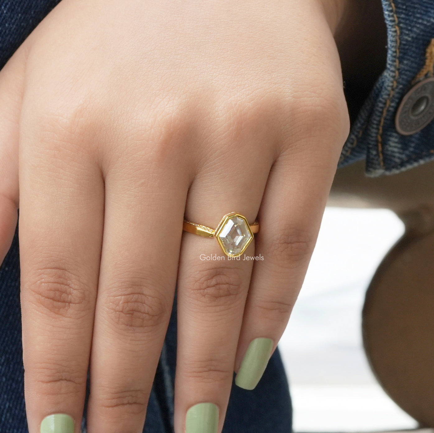 Close-Up View of Hidden Halo Moval Cut Moissanite Ring In Yellow Gold