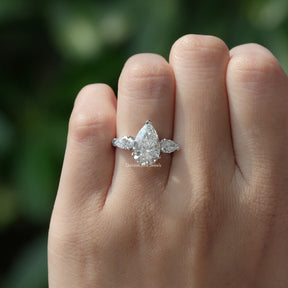 Pear Cut Diamond Engagement Ring In finger