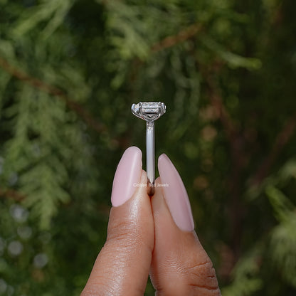 Toi et moi moissanite ring detail with bezel-set pear stone and prong-set top