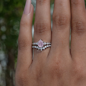 Pink Pear Cut Gemstone Halo Ring In finger
