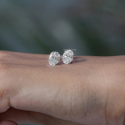 In Hand View Of an oval lab diamond Earring