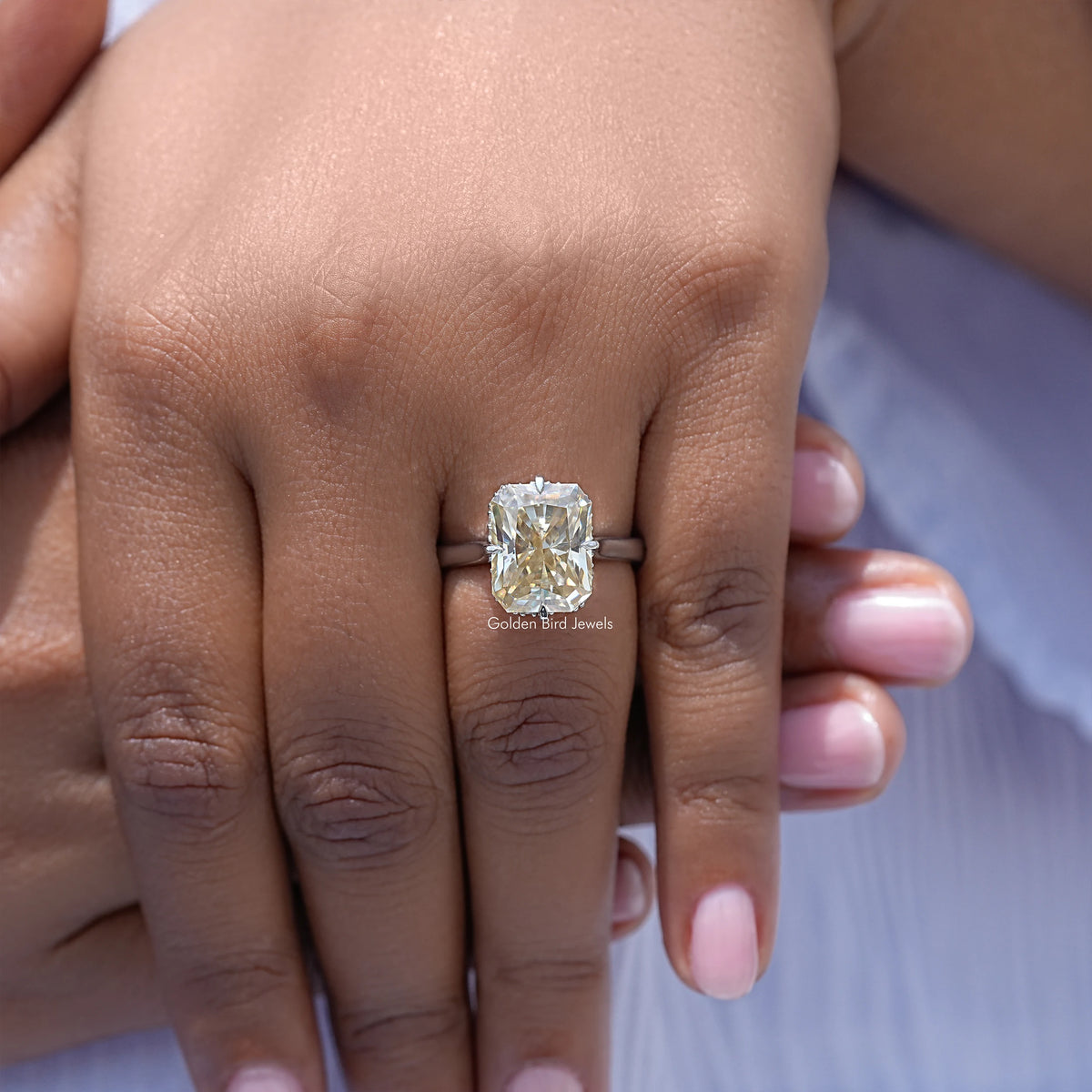 Yellow radiant-cut moissanite engagement ring, square center stone in raised silver band