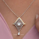 View of Portuguese cut moissanite solitaire pendant 