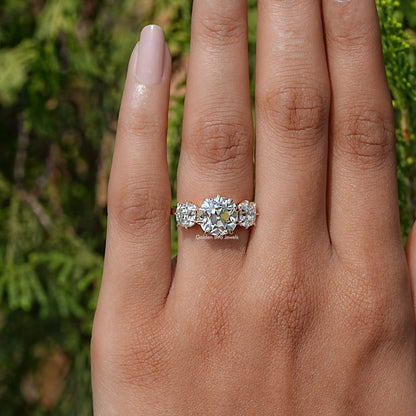 View of Old Mine Cushion Cut Diamond Three Stone Ring In Yellow Gold