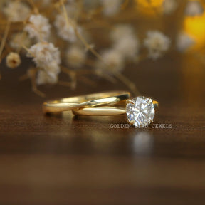 View of Round Cut Moissanite Engagement Ring In Yellow Gold
