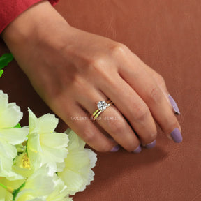 Colorless Round Cut Moissanite Ring In Finger