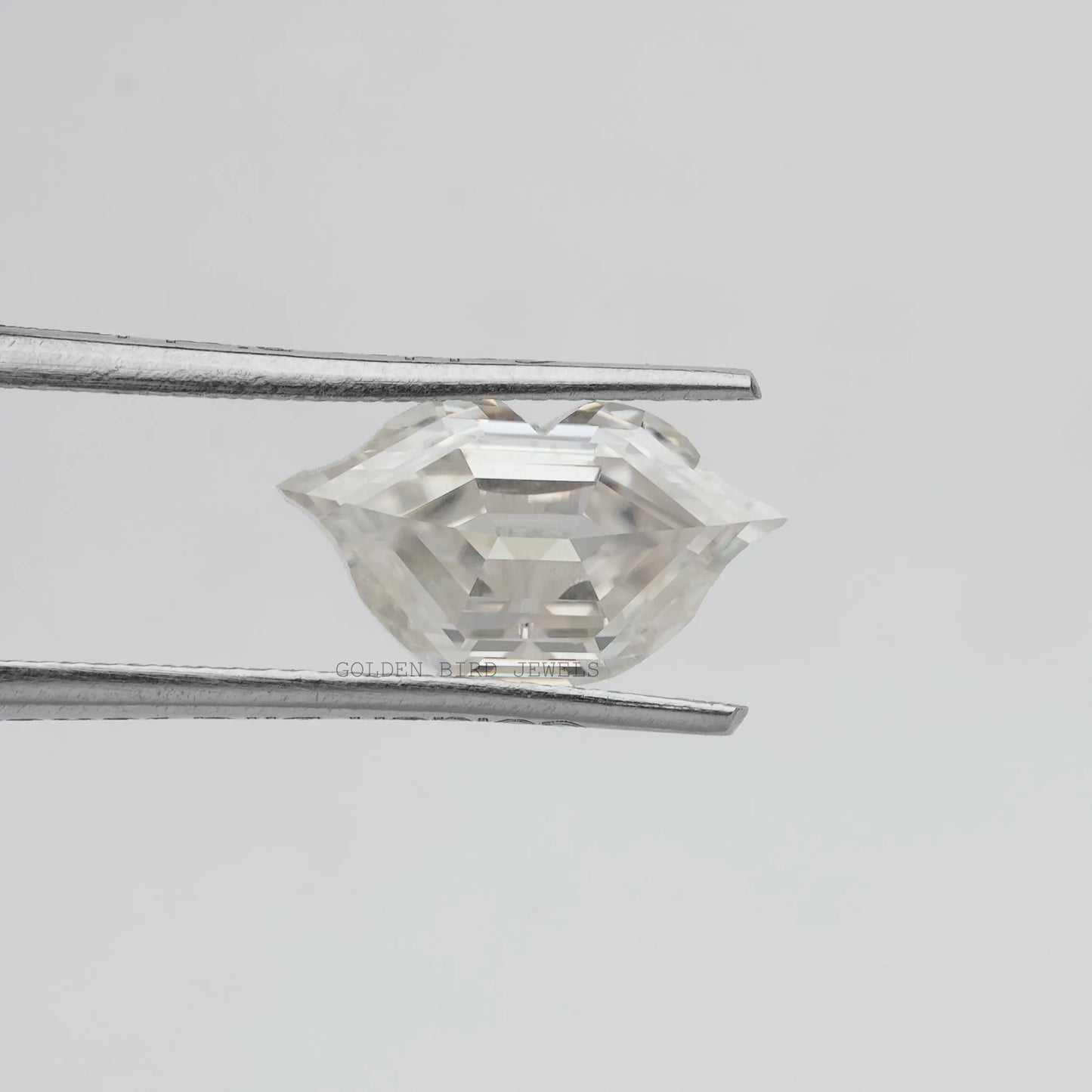Tweezer holding the Lips Cut Moissanite Antique Loose Stone