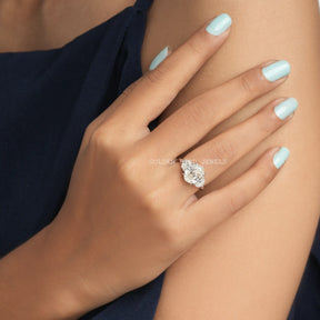  Close-up view of an oval step cut three stone moissanite  ring